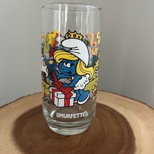 Vintage 1983 Smurfette cartoon opening a present Glass - Peyo